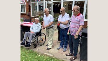 Lancashire care home gentlemen have a game of boules
